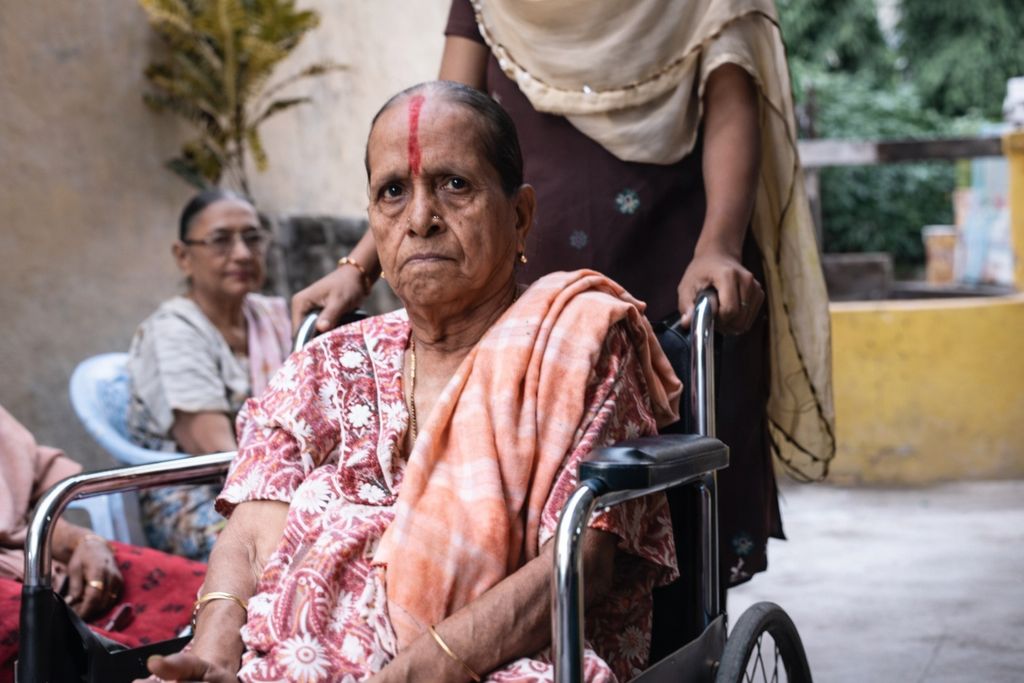 Wide accessible corridor with safety handrails and non-slip flooring for mobility support