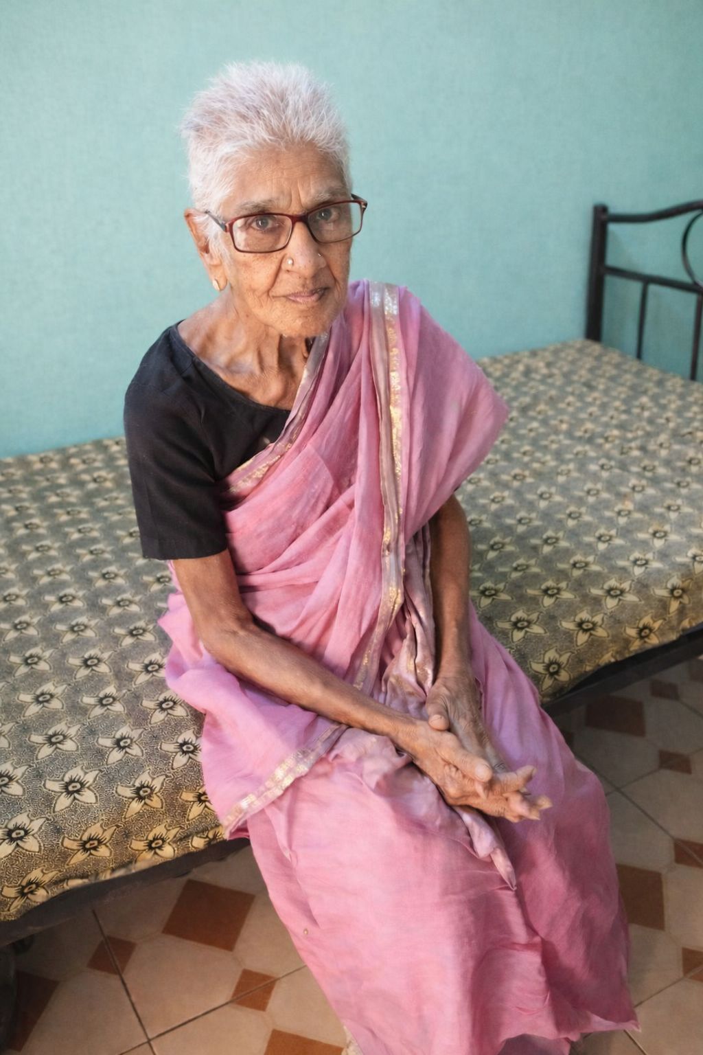 Attentive caregiver assisting elderly resident with personal care needs