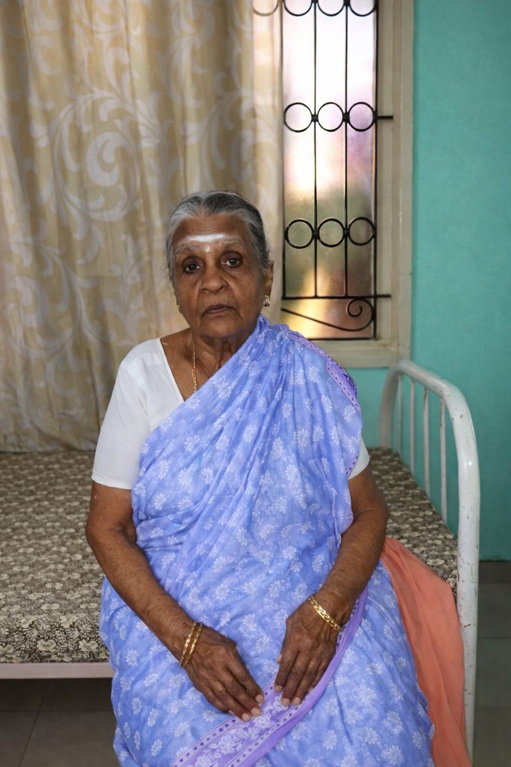 Senior resident enjoying peaceful afternoon in the garden courtyard